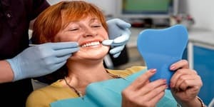 Implante de dentes na Logo da Dr Guilherme Santana, dentista em BH da Clínica BH Sorriso em Ipatinga